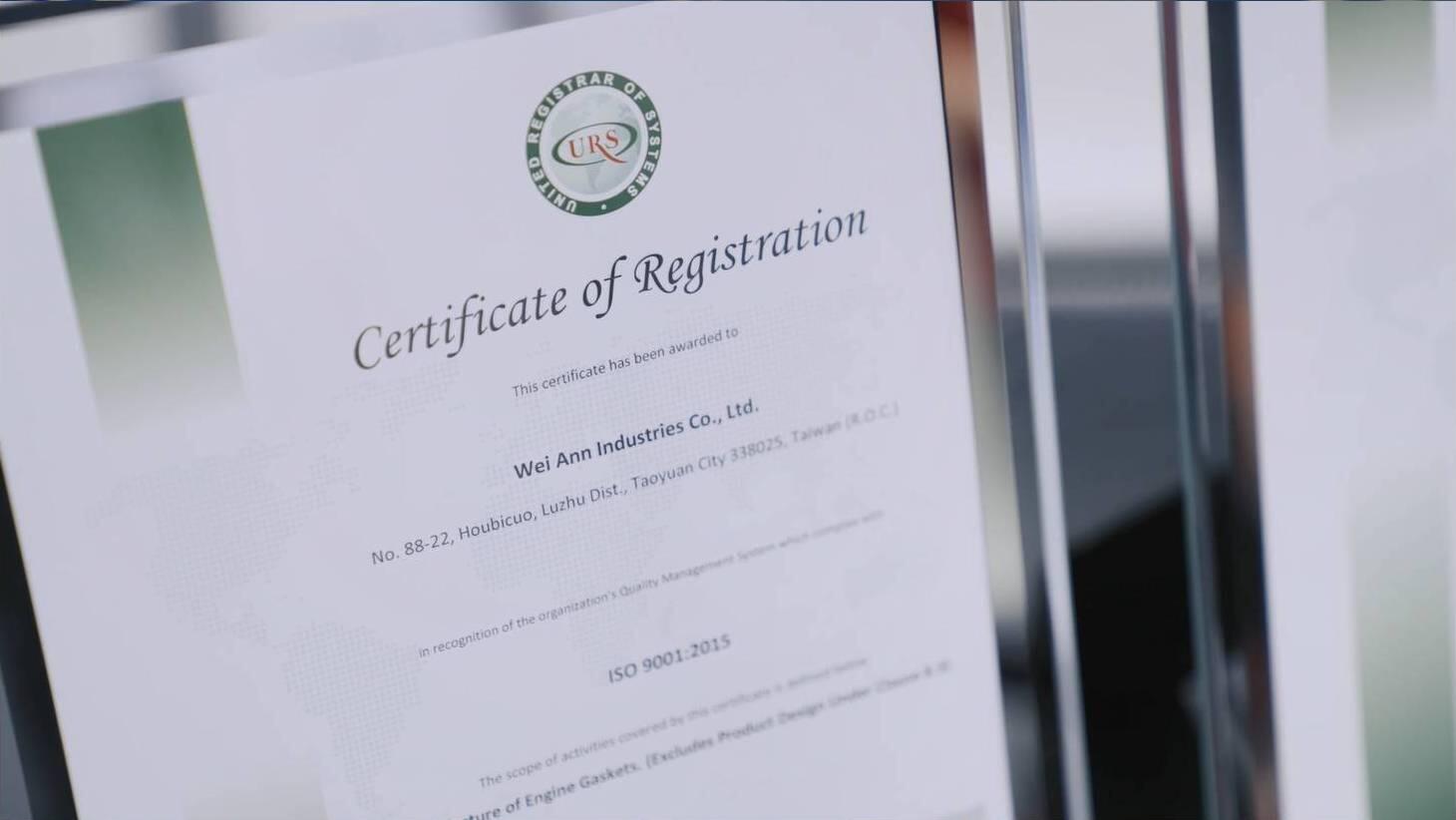 The image displays a close-up, angled shot of an official "Certificate of Registration" awarded to Wei Ann Industries Co., Ltd., recognizing their compliance with ISO 9001:2015 standards.